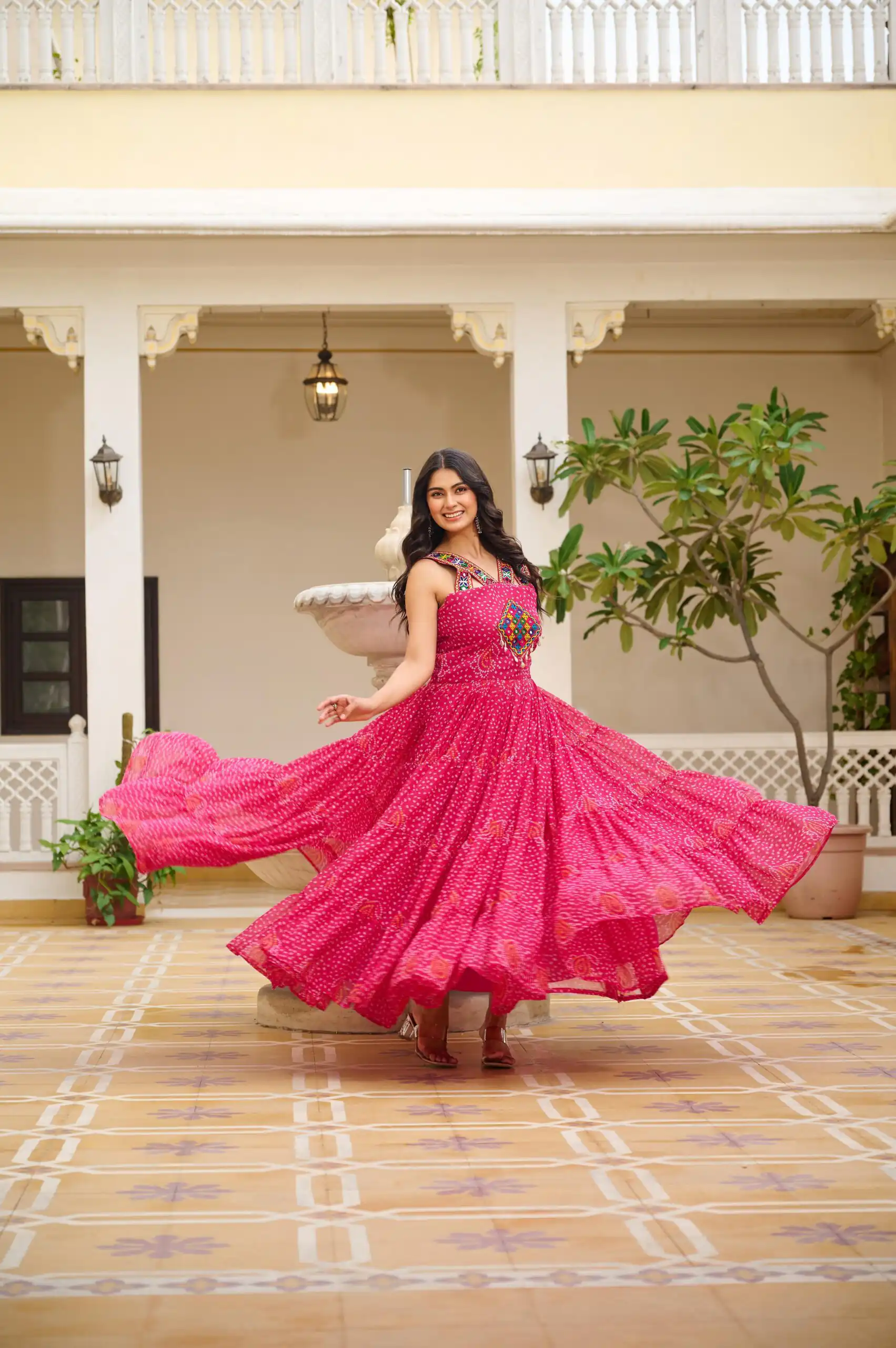 Graceful Pink Georgette Bandhni Print Mirror Work Gown