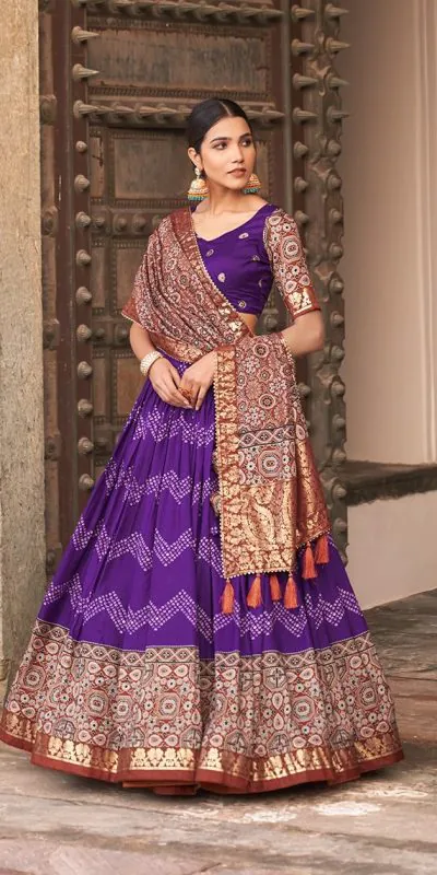 Glamorous Purple Color Tussar Silk Dot And Ajarakh & Drawstring With Foil Printed & Heavy Tassels Lehenga Choli