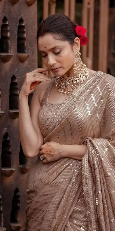Majestic Chiku Color Georgette Beautiful Embroidery Saree